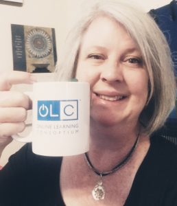 OLC Member Amy Pate holds up a coffee mug before an early morning session, submitted via Twitter @pate_al