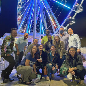 Group of OLC Accelerate attendees standing in front of Capital Wheel in National Harbor, Maryland